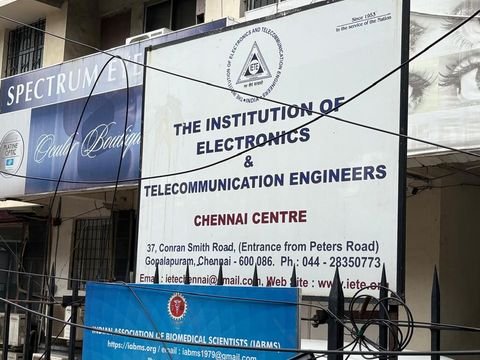 Entrance signboard, giving the address and telephone number